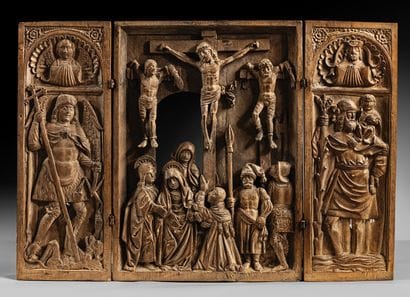 Walnut triptych carved in bas-relief, depicting...