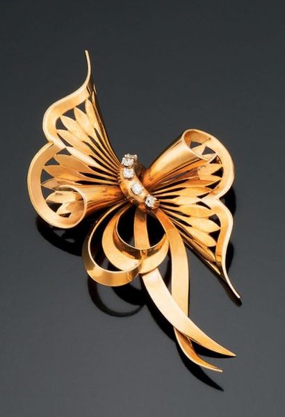 BROCHE NOEUD en or jaune 18K 750 millièmes,...