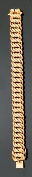 BRACELET ARTICULÉ en or jaune à doubles maillons...