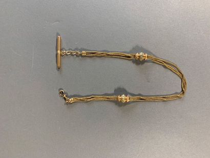 Chaîne de montre en or 18K.
Poids 18.6g