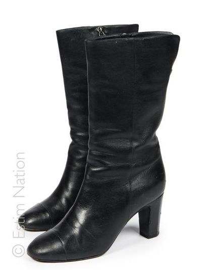 CHANEL
Pair of mid-high black leather boots,...