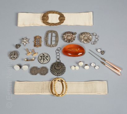 ANONYME
TWO cloth belts with large buckles,...