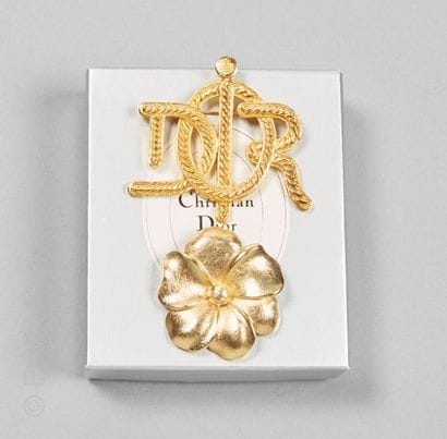 CHRISTIAN DIOR
TWO GOLDEN METAL PINS: the...