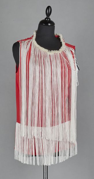 Hotel
TWO crepe TOPS with fringes: the first...