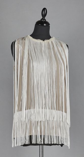 Hotel
TWO crepe TOPS with fringes: the first...