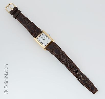 BAUME ET MERCIER
Tank style watch in 18k...