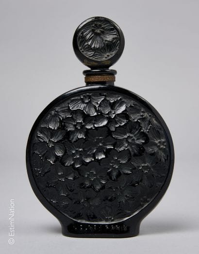 VOLNAY
Black opaque glass bottle. Lenticular...