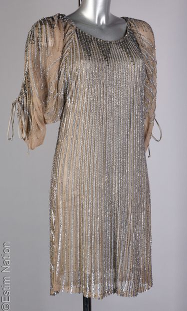 FAUST COUTURE
Evening gown featuring a gray...