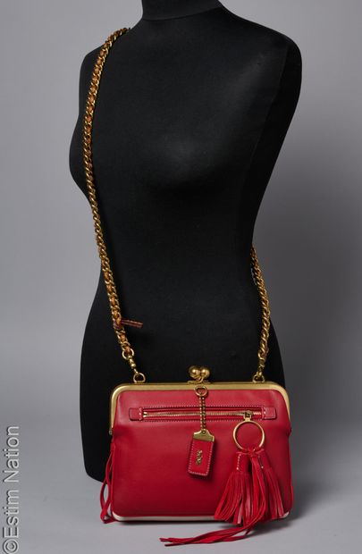 COACH
BAG made up of two calfskin clutches,...