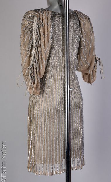 FAUST COUTURE
Evening gown featuring a gray...