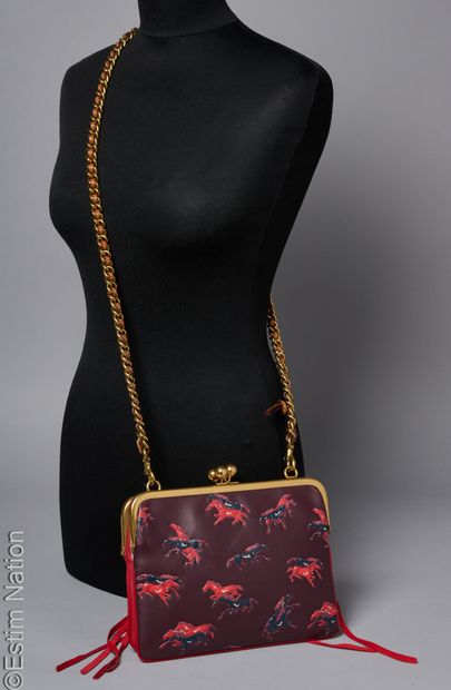 COACH
BAG made up of two calfskin clutches,...