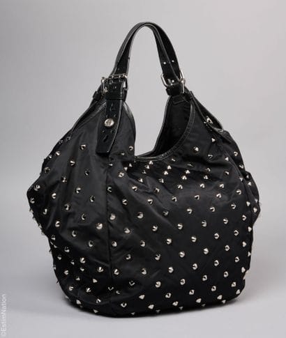 GIVENCHY
CABAS in black nylon, leather handles,...
