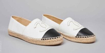 CHANEL
PAIR OF black and white distressed...