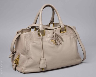 PRADA
Taupe calfskin bag with three compartments,...
