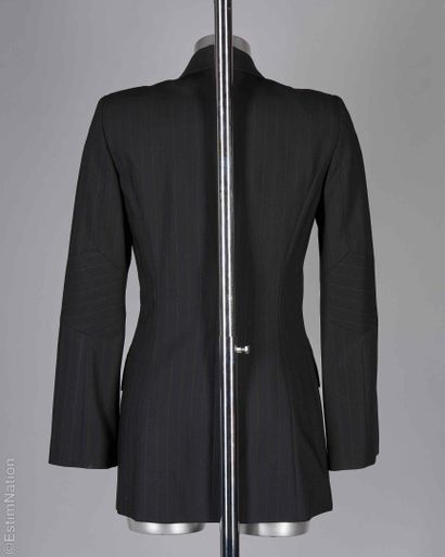KENZO JUNGLE
Black wool jacket with tennis...