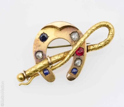 18K GOLD HORSESHOE BROOCH
An 18K yellow gold...