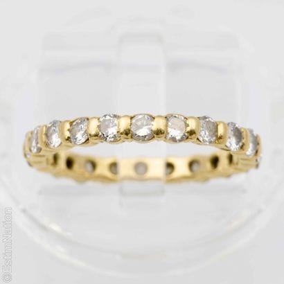 YELLOW GOLD AMERICAN WEDDING RING WITH DIAMONDS
18K...