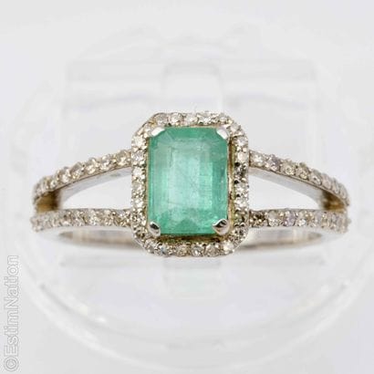 EMERALD AND DIAMOND RING
A 9K white gold...