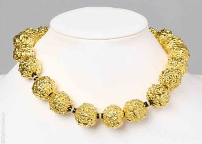 NECKLACE
Necklace composed of chiseled gold-plated...