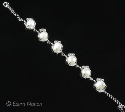 BRACELET PERLES
Bracelet en métal argenté...
