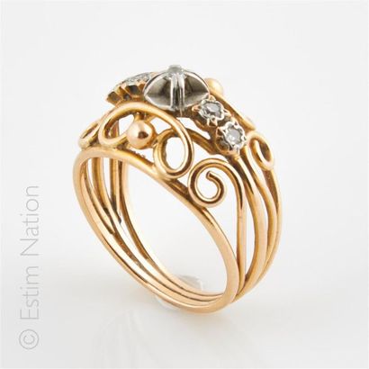 Bague en fils d'or 18K (750°/00) et platine...