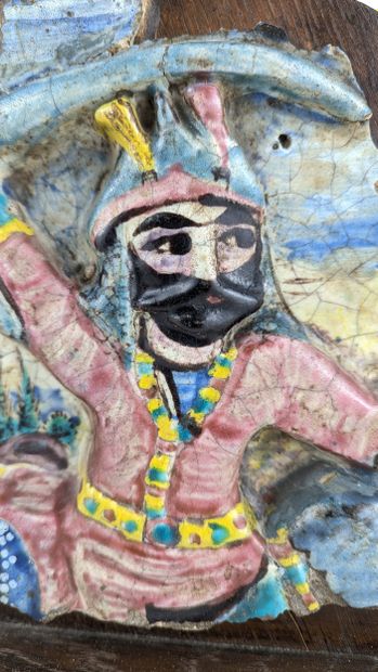 A section of a polychrome glazed ceramic...
