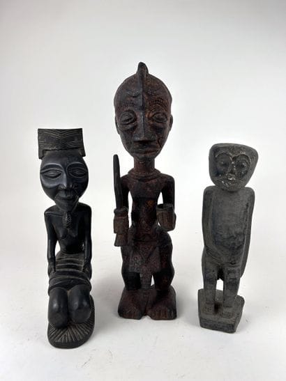SET OF THREE AFRICAN-STYLE STATUETTES
Wood...