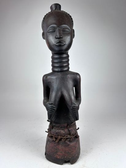 AFRICAN-STYLE STATUE
Wood with a dark brown...