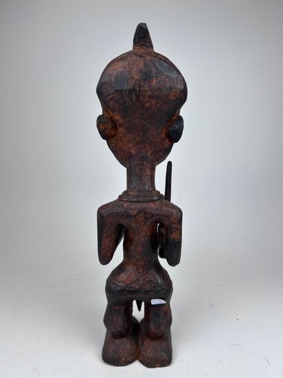 SET OF THREE AFRICAN-STYLE STATUETTES
Wood...