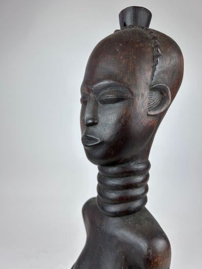 AFRICAN-STYLE STATUE
Wood with a dark brown...