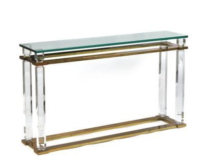 Gilded brass console table resting on a Plexiglas...