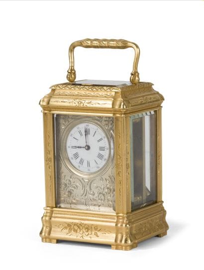 Gilt bronze cage clock with engraved flower...