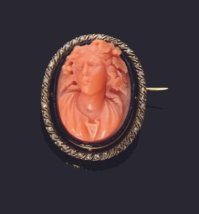 18K (750/000) gold brooch set with a medallion...