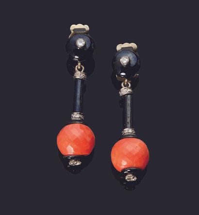 Pair of metal earrings adorned with black...