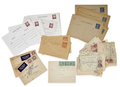 A box containing envelopes stamped with commonly...