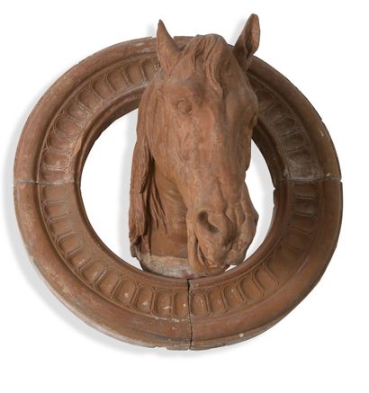 Terracotta decorative element featuring a...