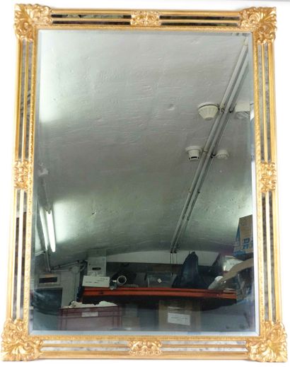 Large gilded wood and stucco mirror with...