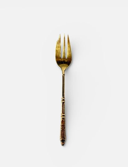 Set of nine dessert forks in gilt metal with...