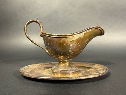 CHRISTOFLE 

Une saucière en métal argenté

Signée...