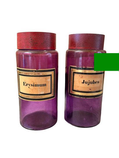 Two purple glass pharmacy vases
with separate...