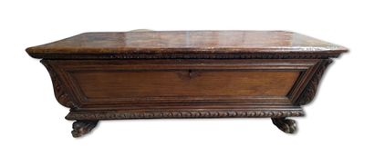 Large carved natural wood chest with a top-opening...