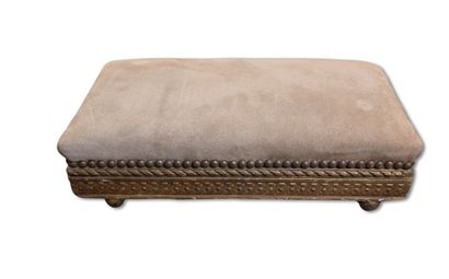 Carved wooden footrest upholstered in beige...
