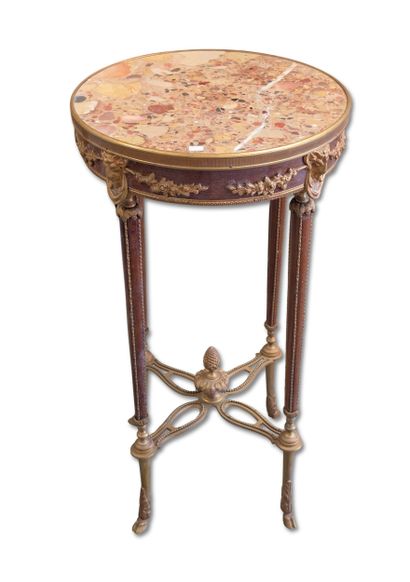 Mahogany and bronze pedestal table with a...