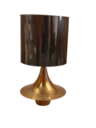 Gold-tone metal lamp with a gold and black...