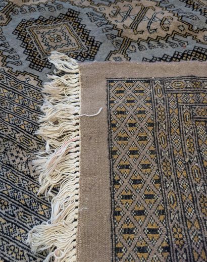 Brown-background Oriental rug with geometric...