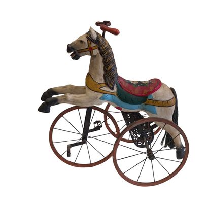 Metal and lacquered wood tricycle featuring...