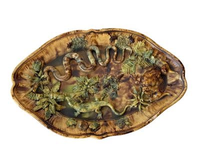 Large oval-shaped dish with scalloped edges,...