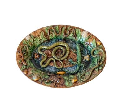 Large oval earthenware dish with a brown...