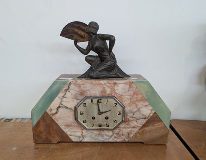 Marble-veneered clock topped with a female...