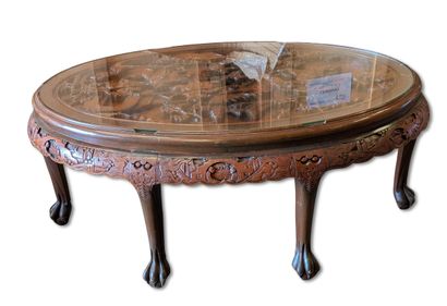CHINA
Carved wooden coffee table with a glass...